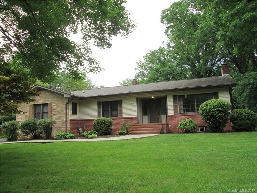 STURDY RANCH HOME...just waiting for your personal touches!  This 3BR, 2BA sits on beautiful level lot in most convenient location.  Featuring large living/dining room combo with fireplace and wood floors, handy kitchen with adjacent screened porch.  Den area with built-ins and unique wood/tile flooring opens to kitchen and generous-sized bedrooms.  Some updating over the years.  Good price, great neighborhood...!