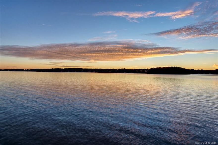 Stunning sunset views from this 1.6 acre lot with an incredible 1,200 feet of shoreline.  Water views from every room in the house you build. This peninsula lot provides you with privacy with no direct neighbors on either side. By gating the driveway you will have a very exclusive and private property with some of the best views on Lake Norman. There is a pier already in place to accommodate multiple boats. The sea wall is commercial grade.