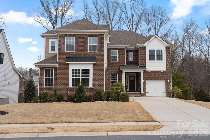 Welcome to exceptional luxury living in the gated community of Bretagne at 9786 Verdun Ct. Built in 2022, this stunning home offers over 5,400 square feet of thoughtfully designed living space, blending upscale finishes, modern functionality, and flexible living options in a private, resort-style setting.

The main level makes a striking first impression with a dramatic two-story living room filled with natural light from expansive windows. Designed for both everyday living and entertaining, this open-concept layout flows seamlessly into a gourmet kitchen featuring premium cabinetry, generous counter space, and an oversized island ideal for gatherings. The formal dining room adds elegance with a beautiful tray ceiling, perfect for hosting holidays and special occasions. A private guest suite with its own full bath completes the main floor, offering comfort and convenience for visitors.

Upstairs, you’ll find four spacious bedrooms, three full bathrooms, and a versatile loft that works perfectly as a media room, home office, or additional living space. The primary suite is a true retreat, showcasing premier finishes, a spa-inspired bathroom with a large tiled shower, and ample space designed for relaxation and privacy.

The fully finished walk-out basement dramatically expands the home’s functionality, making it ideal for multigenerational living or extended entertaining. This level includes a second full kitchen, bedroom, full bath, and an expansive game or flex area with direct access to the backyard—perfect for guests, recreation, or a private living suite.

Outdoor living is just as impressive, featuring an extended paver patio and a paver pathway that wraps along the side of the home, creating multiple spaces to relax or entertain. Additional highlights include a 3-car garage, whole-home water filtration system, and access to Bretagne’s exceptional amenities, including gated entry, pool, playground, and abundant green space.

This home delivers luxury, comfort, and versatility at every level—a rare opportunity to own a move-in-ready residence in one of the area’s most desirable gated communities.