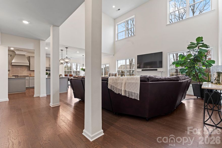 Welcome to exceptional luxury living in the gated community of Bretagne at 9786 Verdun Ct. Built in 2022, this stunning home offers over 5,400 square feet of thoughtfully designed living space, blending upscale finishes, modern functionality, and flexible living options in a private, resort-style setting.

The main level makes a striking first impression with a dramatic two-story living room filled with natural light from expansive windows. Designed for both everyday living and entertaining, this open-concept layout flows seamlessly into a gourmet kitchen featuring premium cabinetry, generous counter space, and an oversized island ideal for gatherings. The formal dining room adds elegance with a beautiful tray ceiling, perfect for hosting holidays and special occasions. A private guest suite with its own full bath completes the main floor, offering comfort and convenience for visitors.

Upstairs, you’ll find four spacious bedrooms, three full bathrooms, and a versatile loft that works perfectly as a media room, home office, or additional living space. The primary suite is a true retreat, showcasing premier finishes, a spa-inspired bathroom with a large tiled shower, and ample space designed for relaxation and privacy.

The fully finished walk-out basement dramatically expands the home’s functionality, making it ideal for multigenerational living or extended entertaining. This level includes a second full kitchen, bedroom, full bath, and an expansive game or flex area with direct access to the backyard—perfect for guests, recreation, or a private living suite.

Outdoor living is just as impressive, featuring an extended paver patio and a paver pathway that wraps along the side of the home, creating multiple spaces to relax or entertain. Additional highlights include a 3-car garage, whole-home water filtration system, and access to Bretagne’s exceptional amenities, including gated entry, pool, playground, and abundant green space.

This home delivers luxury, comfort, and versatility at every level—a rare opportunity to own a move-in-ready residence in one of the area’s most desirable gated communities.