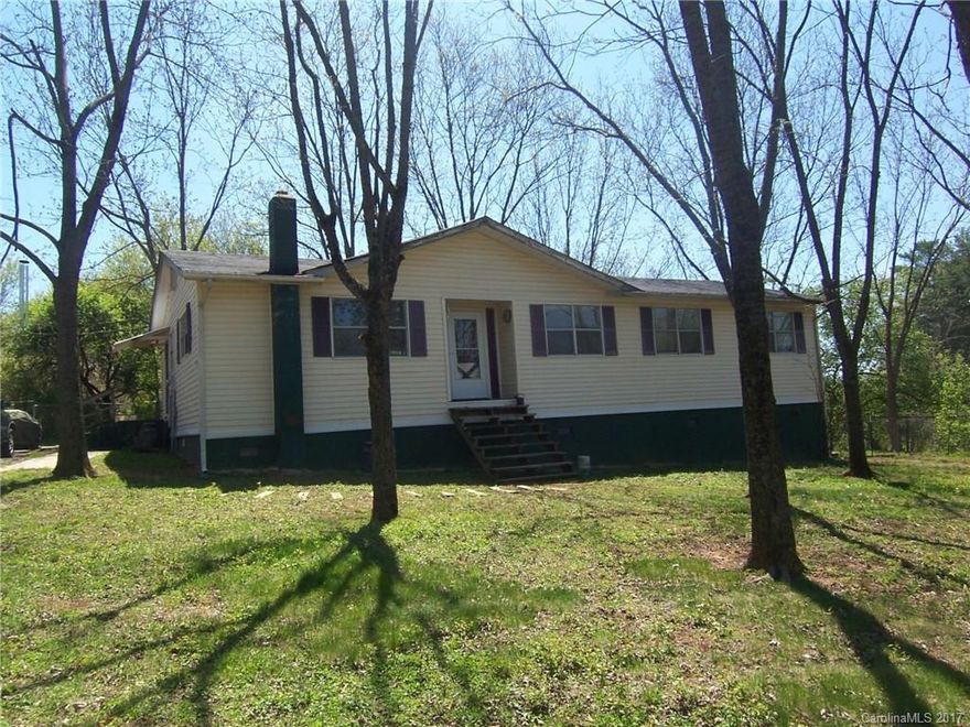 4 bedroom 2 bath ranch home on approximately 1.5 acres. Hardwoods, vinyl, and carpet. Open floor plan. Rear deck. Fenced rear yard with storage building. Nice view of mountains. Priced below tax value. Sold AS IS. Seller to make no repairs.