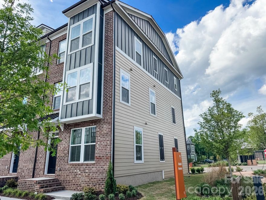 Move in ready! This gorgeous end unit is ready for its new owner and is fully loaded! Don't miss out on this beautiful town home!

Welcome to The River District—a true master-planned community where lifestyle and location come together.

This award-winning Landon three-story townhome offers a thoughtfully designed layout with a first-floor guest bedroom and full bath—perfect for visitors, multigenerational living, or a private home office.

The second level showcases a gourmet kitchen featuring quartz countertops, a built-in oven and microwave, electric cooktop, refrigerator, and soft-close cabinetry. The open-concept dining and living areas create an inviting space ideal for entertaining, while sliding glass doors lead to your private balcony that overlooks commons greens—perfect for relaxing or enjoying your morning coffee. 

Upstairs, you’ll find two beautiful owner’s retreats, each offering a bright, airy bedroom and a spa-inspired bath for ultimate comfort and privacy. A conveniently located laundry area complete with a washer and dryer finish the upper level. Blinds on all operating windows are also included. 

This home is filled with beautifully curated interior finishes, individually hand-selected by our professional design team, creating a cohesive and elevated aesthetic throughout.

Location is everything—and at The River District, you’re truly minutes from it all. Planned community amenities include a resort-style pool, clubhouse with fitness center, tennis and pickleball courts, parks, scenic trails, a working two-acre farm with an on-site farmer, and a riverfront amphitheater.

Experience vibrant, connected living in one of the area’s most exciting communities.