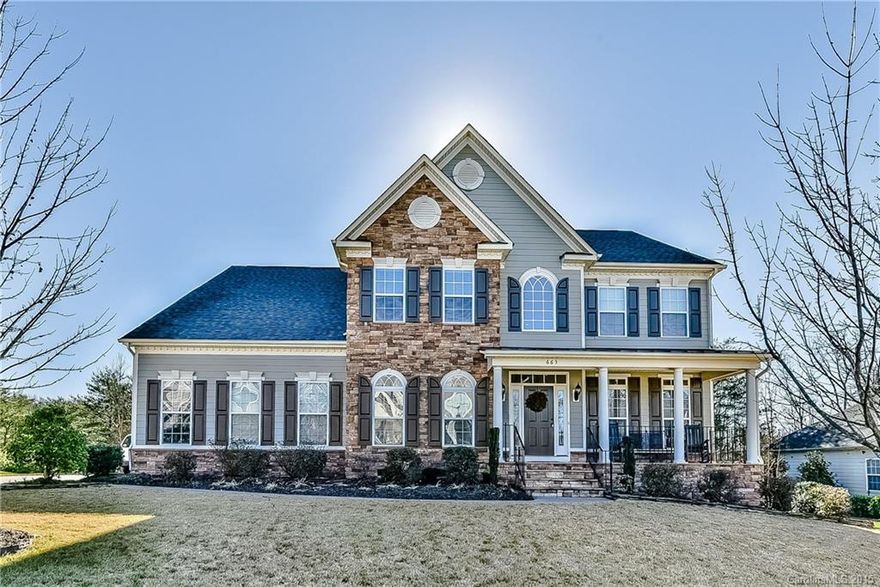 Stunning executive home with open floor plan. 2 story great room. Spacious kitchen with granite & ss appliances. Huge center island & butlers pantry. Bar entertainment area. King size master on main with tiled garden tub & shower. His/Her closets.  Two upstairs bedrooms with jack n jill bath with additional 4th bedroom. Large bonus room. Deck overlooks wooded half acre + lot with stone fire pit. Wide drive 3 car side load garage. Sprinkler system with established landscaping. Tega Cay amenities.