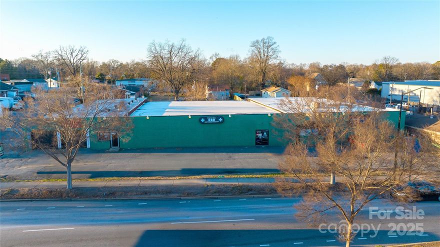 Prime free-standing retail building boasting 230 feet of premium frontage on Cherry Rd, directly across from the bustling Publix shopping plaza. This versatile property offers endless potential—perfect for owner-occupants or investors looking to create a thriving multi-tenant space. With 7 spacious side bays and soaring ceilings in the shop area, the building is ideal for a range of uses. Whether you're ready to lease immediately or envision a value-added renovation, this location positions your business for success in a high-visibility, high-traffic corridor.