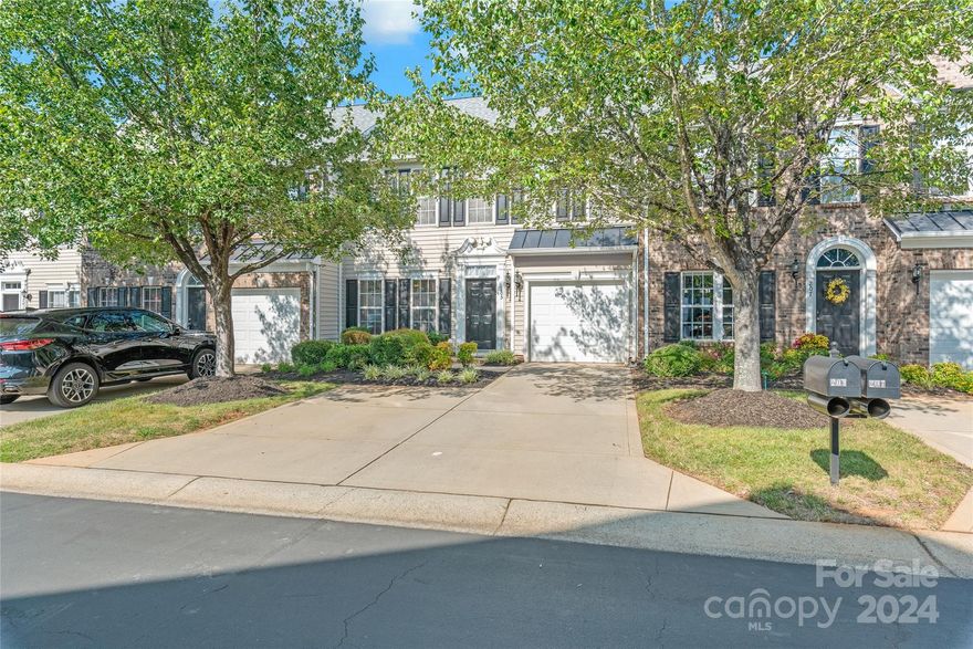 Perfect Fort Mill location! Beautifully updated colonial-style exterior with a modern feel inside. This unit has been beautifully upgraded! In the kitchen, find quartz countertops, 42” maple cabinets, all-new black hardware, and a handmade subway tile backsplash. The downstairs features hardwood floors, new carpet in the family room, and updated light fixtures. Upstairs, the laundry room and bathrooms have new low-maintenance LVP flooring. Freshly painted in neutral tones through out, this open floor plan is filled with natural light. Step outside into an extended area perfect for entertaining. This space can be enclosed for added privacy. Upstairs, you'll find 3 spacious bedrooms with great closet space. There's good storage in the attic and an oversized one-car garage. Enjoy the community pool just a short walk away! Additional updates include new water heater (03/2021), furnace and air conditioner (01/2023), appliances (12/2023), and roof (11/2019). You won't be disappointed!