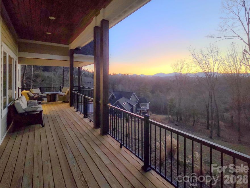 Luxury living in this meticulously crafted home, just 22 minutes from downtown Asheville. A custom builder's personal home, this modern retreat offers breathtaking mountain views and impeccable craftsmanship.

Step inside to 12-14' ceilings enhancing the open floor plan flooded with natural light from expansive Pella windows. Blonde maple hardwood floors complement the custom chef's kitchen and beverage center, featuring a wine cooler with separate settings.

The master suite boasts panoramic mountain vistas and a spa-like bathroom with a soaking tub and separate shower. The lower level features a second kitchen and living space ideal for multigenerational living.

Outside, expansive decks invite relaxation against sweeping mountain ranges. Energy-efficient features, ample storage, and a whole house generator add practicality and charm to this exceptional home.

Schedule your private tour today and experience the epitome of mountain living in this masterpiece.
