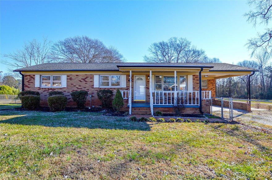 Welcome Home! You'll want to hurry on this inviting full-brick ranch-style home in a peaceful area in the growing community of Bessemer City. Come and enjoy the kitchen, which has been redone with new cabinets and granite countertops. The bath has had beautiful updates as well and the rooms are nicely sized. The home has a rocking chair front porch with built-in brick planters on both sides, a fenced front yard, and a one-car carport. Also, being situated on a corner lot and having a large backyard with an outbuilding make it easy to enjoy your outdoor living space and even store your camper! Plus, there's no HOA! The location is convenient to everything you need, including outdoor activities at Crowders Mountain!