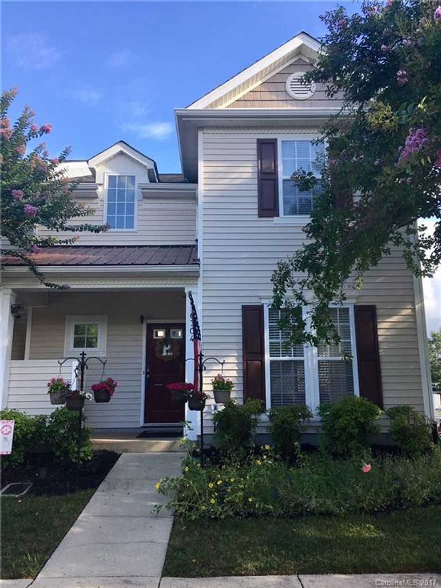 Move in ready end unit townhome in Arlington! New countertops, stove, oven, dishwasher, garbage disposal and microwave! Gorgeous laminate wood flooring throughout the first floor. Newer carpet and recently painted. New AC and roof is only a couple years old. Open layout and 2 story great room. Loft area upstairs. Master on main. Community pool. Easy commute to Ballantyne too.