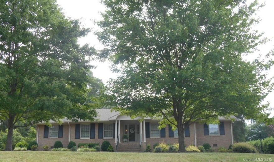 Big Home, Bigger Value! Both the yard and home are spacious and well kept! Well planned landscaping and a well built ranch style brick home with formal living and dining, den with gas log fireplace and spacious, remodeled kitchen. Hardwood and laminate flooring along with tile. Sun room with mosaic red stone floor overlooks back yard off double attached carport. Storage bldg. Gazebo, extra parking. Convenient to hospital, shopping, Country Club, and down town attractions.