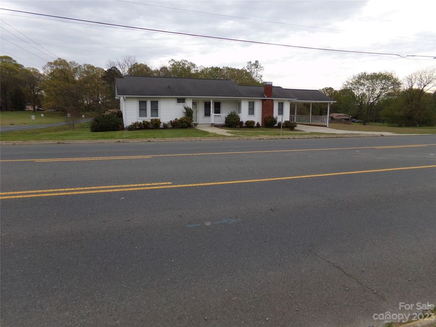 WELCOME TO THE FAST GROWING CITY OF LOCUST.    This property could be your new venture or your new home.  Zoned Center City which will allow this house to be converted for commercial use or used residential.  Lovely and well maintained home located on a hard corner (Elm and South Central Ave) with .68 +/_ land. No carpet in this house just beautiful prefinished hardwood floors through out. Large master bedroom with built-ins and master bath with walk-in closet or could be used as an additional living room. Set on the back deck and enjoy the cool evenings or enjoy your morning coffee.   2 additional bedrooms with closets.  Small building for storage.  Also Storage area under the house.  Beautiful flowering bushes around house.   The house plan is very unique and ready for you to call it home or your business.  Being located in the heart of the city is a plus for conveniences to restaurants and shopping areas, etc.  Call today to come see this property THANK YOU FOR YOUR INTEREST.