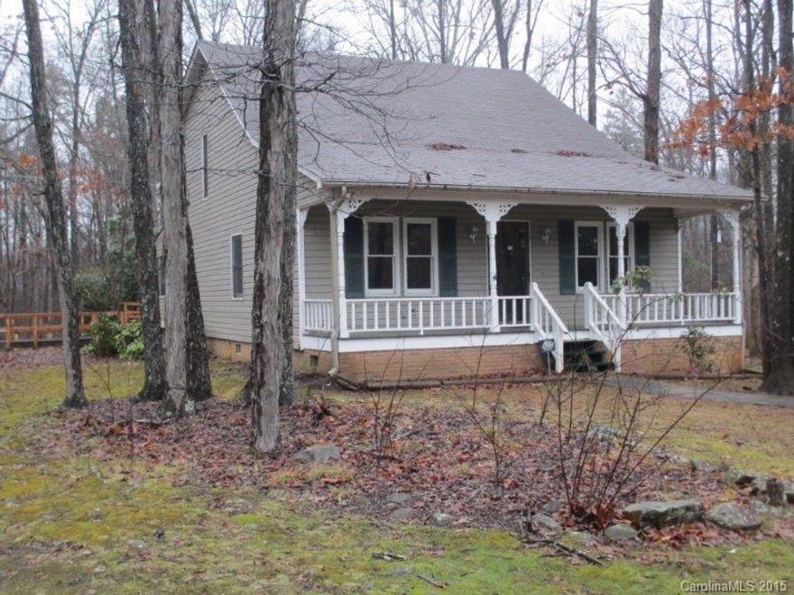 Wonderful open home with large front porch on 2 acres just minutes from I485. Has a screened in porch and decking for an above ground pool already in place. Spacious two story great room overlooks stone wood stove area.  Just bring you own wood stove. Perfect location and still very country feeling located on edge of cul-de-sac.