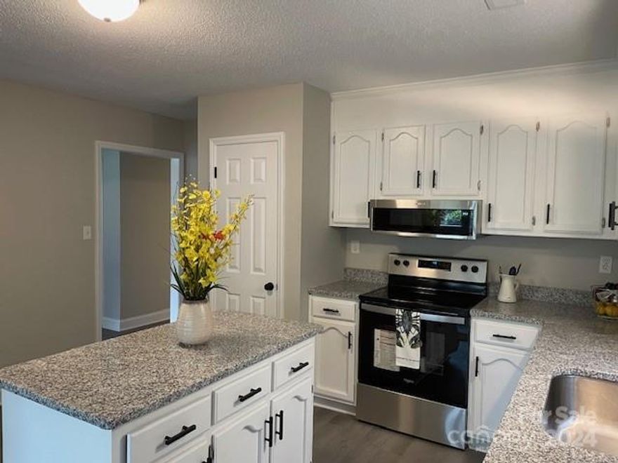 Extensive Rehab Includes NEW: SS Appliances, 9" Undermount Sink, Granite Countertops, Cabinet Pulls, Luxury Vinyl Plank Flooring ( No Carpet ) Vanities, Toilets, Designer Faucets, Mirrors, Lighting, Ceiling Fan, Door Knobs, Hinges, Hardware, Supply Lines, etc. Too much to List..!! Also, Refurbished Kitchen Cabinets with Soft Close Feature, Also: New HVAC, Thermostat and 30 Year Architectural Roof..!! Fresh Paint Inside. Move In Ready..!! Main Level Entrance. No steps to climb. Pet Friendly. Quiet Wooded Setting in cul de sac. Huge " Double " Carport and Shed off the Carport. You can literally park 4 - 6 vehicles in the carport depending on their size. The carport size is approx. 34' X 18 '.The Shed is approx. 18 ' X 10 '. Bring your ATV's, Boats, Trucks, Motorcycles, Classic Cars..!!  No Pesky HOA to Deal With..!! Flat Yard. Move in Condition. With Most Everything New this should be Somewhat Maintenance Free.