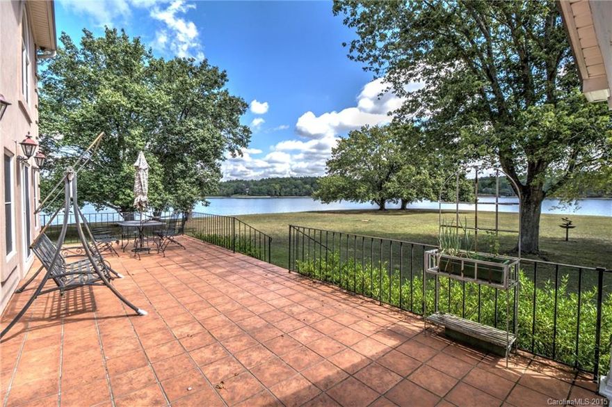 One-of-a-kind waterfront home on a point lot, a landmark on the Big Allison Creek channel of Lake Wylie. Reinforced by a seawall, this level lot has 550'+ shoreline and a panoramic view of the lake. Home has lots of flexible living space and huge screen porch to enjoy the outdoors. Kitchen updated w/ granite and stainless appl., plus gorgeous hardwood floors & other updates added in 2015. Boathouse & dock on the cove side. Located in excellent Clover school district, low SC taxes, no HOA.