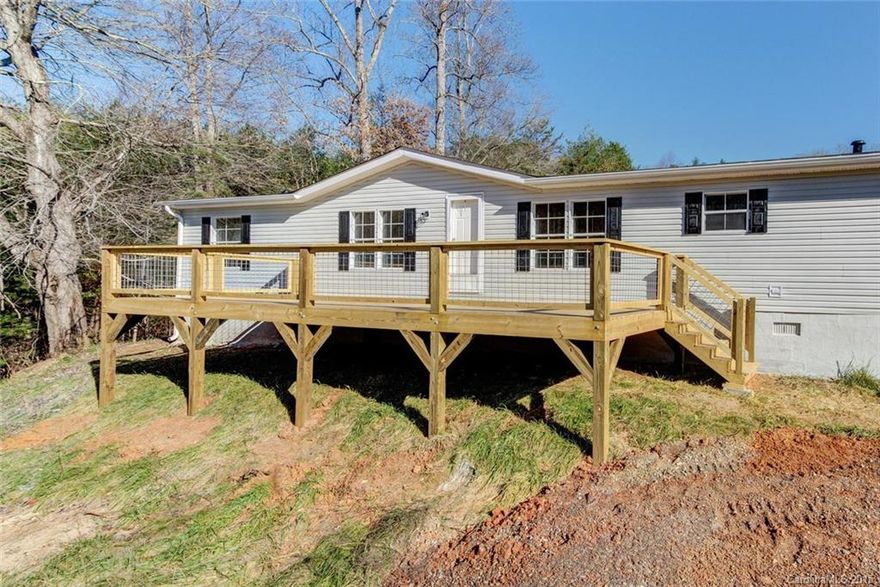 You won't believe your eyes; this manufactured home is tucked privately at the end of a private drive. What might appear to be a standard affair, has been fully renovated and features a new roof, carpet, and laminate wood flooring. Kitchen features new grant counter tops and stainless appliances in an open floor plan home. Your favorite part of the home will be either the wood stove surrounded by 100 year barn wood or the expansive back deck for looking over you land.