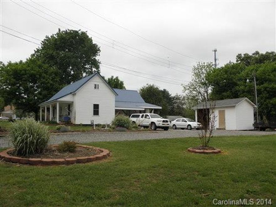 Wonderful extended bungalow with gleaming hardwood floors, living room with fireplace, dining room and spacious kitchen. Main level bedroom and bath and a second bedroom upstairs with den.  Completely maintenance free exterior, metal roof, private rear deck and large out building. Fenced dog run and kennel. Very well maintained and a delight to show. Quite street in sleep Stony Point neighborhood.