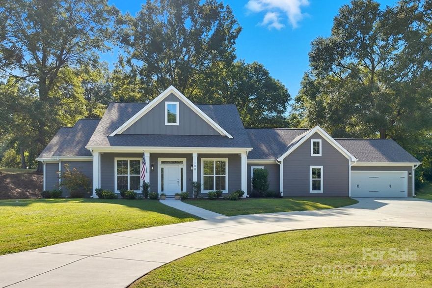 Discover Coulwood Hills, one of Charlotte’s best-kept secrets, where quiet streets, spacious lots, and mature trees create a true community feel. This custom 2023 ranch sits proudly on a corner lot and was designed with thoughtful detail—every inch maximized for storage and living. The open concept floor plan features a chef’s kitchen with gas range, oversized pantry, and a dedicated laundry room. Outdoors, a covered patio offers the perfect spot to enjoy your half-acre lot. Neighborhood amenities include the Coulwood Swim Club, while nearby conveniences like Riverbend Village bring shopping, dining, and even a Harris Teeter that turns grocery runs into a night out with live music and games. All this just minutes from Uptown Charlotte and Charlotte Douglas International Airport, blending small-town charm with city convenience.