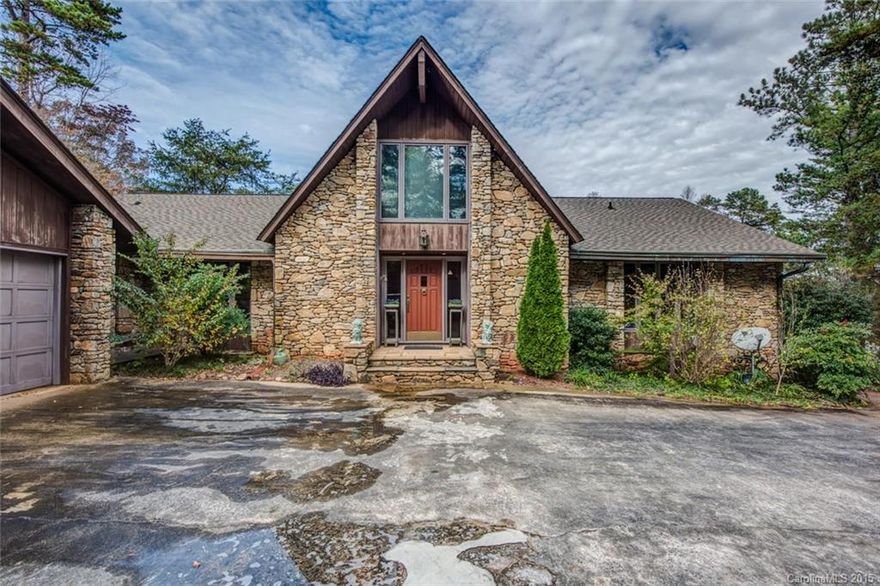 It is "Just One of Those Homes" Stone and Cedar exterior. Post and Beam construction with tongue and groove walls & ceilings. Beautiful view of lake at Heatherloch. Dramatic stone fireplace is central to great room. Formal Dining Room. Home offers lots of potential, but needs some updating, but the price would allow. Home features copper gutters and downspouts. Floor attic offers possibility of additional bedrooms. Home can be a SHOWSTOPPER!