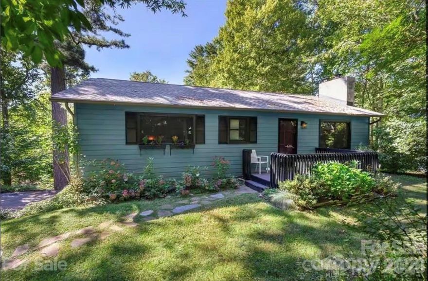 Investors take notice—this move-in-ready property boasts a proven rental history for the past four years and is ideally located just five minutes from the proposed Advent Medical Hospital off 25/70. Offering the perfect balance of privacy, nature, and convenience, this home sits close to both downtown Weaverville and Asheville.

Upstairs, you’ll find Andersen windows, vaulted ceilings, and abundant natural light that create a warm, inviting atmosphere. Hardwood floors run through the bedrooms, and the updated kitchen features butcher block countertops, a classic subway tile backsplash, and durable tile flooring. Cozy gas fireplaces on both the main level and downstairs add charm and ambiance throughout the home.

The primary suite includes new wood floors, double closets, and an ensuite bathroom. A second bedroom offers a private sliding door leading directly to the back deck, perfect for enjoying the outdoors.

The finished lower level expands your options with a den, full bathroom, gas fireplace, and a Murphy bed, making it ideal for a studio, guest suite, or separate living space. Major updates include a roof installed in 2017 and HVAC in 2018.

Step outside to enjoy a tiered deck and a large, fenced yard, ideal for entertaining, pets, or simply relaxing in a peaceful setting. Whether you’re looking for a primary residence, investment opportunity, or flexible live-work space, this home checks all the boxes.