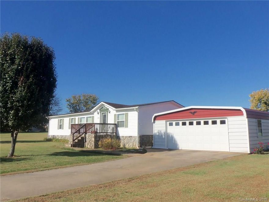 Manufactured home on an acre of land (no sub division)  over 1500 sq feet. Roof new 2007 Vinyl siding new in 2009 New compressor on HP in 2014 Very Charming home detached wired garage. Paved walk way back and front. Front porch and Back Deck  Nice area in West Lincoln. Bookshelf at entrance and shelves in sewing room do not convey