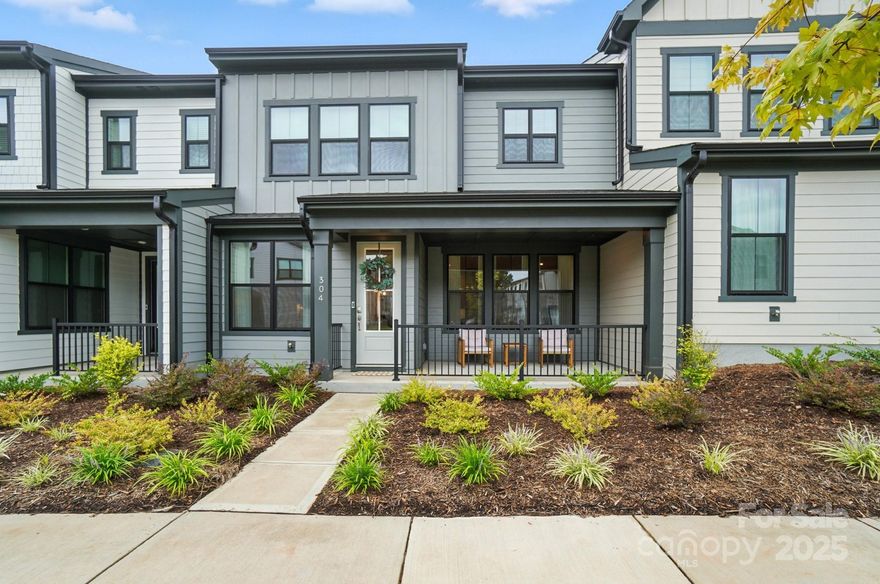 Like new and ready to move in! This immaculate townhome offers an open layout with designer finishes! The upgraded kitchen features under cabinet lighting on a switch, a single bowl undermount stainless steel sink, gas cooktop, under cabinet vent hood, built-in stainless steel microwave and wall oven combo, and tons of pantry space! The oak box staircase with open rails brings you upstairs to a versatile loft. On one side of the second floor is the spacious primary suite, including a private bathroom with tiled shower and dual vanities, and a large closet. The other side of the second floor includes a convenient upstairs laundry room, an additional full bathroom with dual vanities, and two spacious secondary bedrooms with ample closet space. Outside, relax on the covered front porch, or meet your neighbors at the community pavilion and activity lawn. Come enjoy low maintenance living just minutes from Lake Wylie and downtown Belmont!