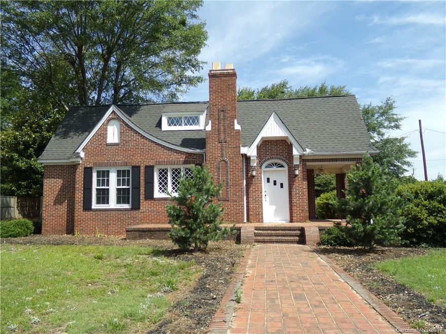 REDUCED!! Make this charming older house a home with your own update ideas.  It is situated on a corner lot within walking distance of most Pageland area amenities.  First floor features a living room with fireplace, dining room, kitchen, two bedrooms, one full bathroom and office.  Second floor features two bedrooms and one full bathroom. Entertain or relax on the rear deck.  Other features include privacy fence, detached storage and guest house/hobby shop.