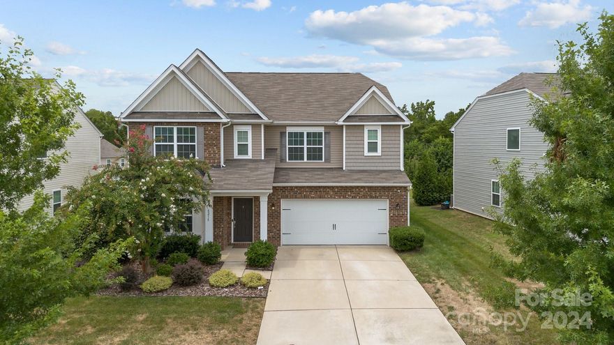 Welcome to this beautifully updated 5 bedroom, 4.5 bath home in the desirable Berewick neighborhood. New LVP throughout the main floor. First floor features a dedicated office, open living area, and full bedroom/bathroom.  The kitchen boasts stainless steel appliances, freshly painted cabinets, and large farmhouse sink. Upstairs you will find a spacious loft, primary bedroom with large ensuite bathroom and walk in closet, along with 3 additional bedrooms with attached baths. Spacious paver patio with new landscaping and firepit. Two-car garage with level 2 EV charger. Amazing neighborhood within minutes to I-485, Charlotte Douglas International Airport, Charlotte Premium Outlets, and many new restaurant options. The neighborhood features a clubhouse, pool, walking trails, and playground.