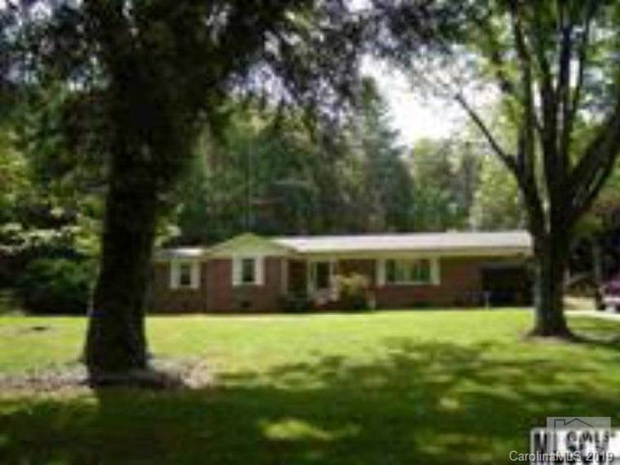 55 Acres of beautiful rolling hills, and some woods with 3 bedroom, 2 bath brick ranch! This property affords large creek that runs throughout the pasture. Huge barn, separate 2-car garage with wired workshop. Fencing for pasture. House has spacious LR, kitchen with bar & dining area and huge master bath. Laundry room with washer & dryer. Sliding doors to patio on back. Acreage across the street is fully wooded. A peaceful setting! Priced at $4500 an acre. Property is located on both sides of Miller Creek Rd. See tax map Seller willing to divide property as follows - Land across street approx 25 acres $99,900 and home with approx 30 acres $224,900. Subject to buyer survey.