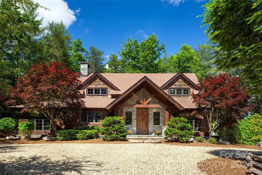 From the moment you walk through the custom mahogany front door you are captivated by a magnificent view of Lake James. Classically beautiful and thoughtfully designed, this custom-built gem is located in Old Wildlife Club where the property is level and the views are stunning. An easy and short walk from the great room will lead you to your well-built dock. From there, gaze out over the spectacular open view of Lake James. On the main floor, the refined elegance of this home includes a primary bedroom, a guest bedroom, and a gourmet kitchen that opens to a gorgeous great room with a vaulted ceiling and stunning stone fireplace. It’s the perfect gathering space. The second floor features a large en-suite bedroom with sitting area and private terrace with views of the water. A large recreation room on the lower level includes a full workshop and bonus room. Outdoor living at its best with private screened and roofed porches. Camp Lake James membership is included!