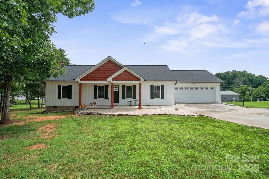 Welcome to this move-in ready ranch home in Statesville, built in 2021 and meticulously maintained! This single-level, split-bedroom floorplan offers 3 bedrooms and 2 full baths with modern finishes throughout. Enjoy vaulted ceilings in the open-concept living/dining/ & kitchen areas perfect for entertaining. The kitchen features granite countertops, stainless appliances, pantry, and a convenient mudroom/laundry area located just off the fully finished 2-car garage. The primary suite includes 2 closets, one oversized, and a spacious ensuite bath with a walk-in shower. Luxury vinyl plank flooring throughout the home, durable and low maintenance. Outdoor features include a large covered front porch, upgraded Trex rear deck, and a flat backyard fully enclosed with a black chain link fence in pristine condition with two gates. Located in a quiet, cul-de-sac community with easy access to I-77 and I-40, this home checks all the boxes for comfort, style, and convenience. Showings begin 7/24!