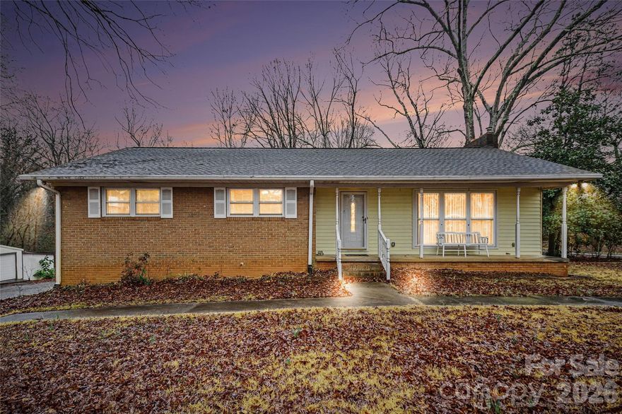 Charming brick ranch on 1.3 acres with tons of potential! This 3 bedroom, 2.5 bath home is a true diamond in the rough, offering solid bones and ready for your personal updates.

Hardwood floors welcome you into the formal living room, while the open kitchen and dining area create a comfortable space for everyday living and entertaining. The full basement provides abundant storage and flexible space for a recreation room, office, gym, or hobby area. An oversized one-car garage with workspace adds even more versatility.

Enjoy peace of mind with a whole-house generator, plus a covered carport and storage shed for additional parking and storage. Convenient to I-485, Charlotte, and Mint Hill, and close to shopping and dining — this property offers space, privacy, and incredible opportunity.