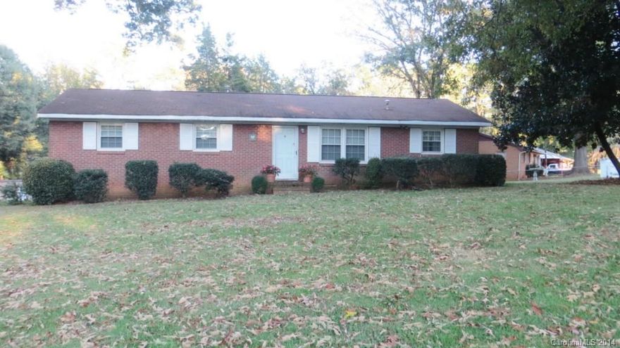 Beautiful setting on a little over an acre. All brick home with new windows. Convenient to School. Extra Auxiliary gas heat. 24x24 Building is wired and is perfect for shop. Was originally 3 bedroom home and could be changed back. Hardwoods under carpet. Also know as 3499 Lewis Rd.