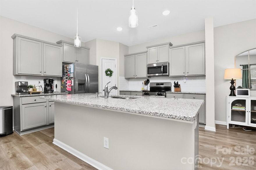 Welcome to McGee Place in Charlotte’s desirable 28216 zip code! Built in 2023, this move-in-ready two-story home offers 4 bedrooms, 2.5 baths, and approximately 2,100 heated square feet of well-designed living space. The open-concept main level features a spacious kitchen with a large island, walk-in pantry, and seamless flow into the dining and living areas—perfect for entertaining and everyday living. Step outside to enjoy the patio and fully fenced backyard, ideal for grilling, pets, or relaxing evenings at home. With neutral finishes, modern style, and an easy commute to Uptown Charlotte, this well-maintained home is a fantastic opportunity for buyers seeking a newer construction home with space and convenience in North Charlotte.