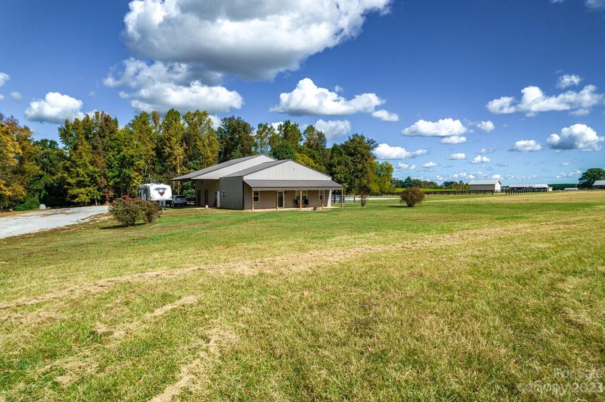 Welcome to your own equestrian paradise! Nestled on 13 picturesque acres, this delightful "bardominium" offers a unique blend of rustic elegance, modern comfort, & unparalleled outdoor amenities. The open-concept living area features soaring 12'ceilings and there's a well-appointed kitchen with access to the 1403 sq ft barn and tack room through the walk-in pantry. The heart of this property is its equestrian facilities, featuring 3 stalls with padded flooring, a jumping arena allowing ample space for training & enjoyment, and a fenced area for secure turnout for your horses. The awe-inspiring mountain views & starry skies can be enjoyed from your own backyard, covered porch, or by the fire pit. Nature enthusiasts will appreciate the endless opportunities for outdoor recreation & gardening that this expansive property has to offer. This tranquil, private setting offers the ideal escape from the hustle & bustle of city life, yet is conveniently located near amenities & services.