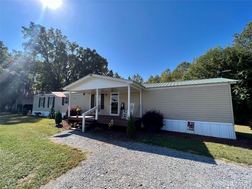 Looking for a private country setting with acreage? Welcome to 1508 Scenic View! This 3-bedroom 2 bath manufactured home (16 x 80) singlewide sits on 3.5 acres with abundant privacy and a tree-lined backdrop. The kitchen offers a nice size island with seating for three, adjoining the dining and family room areas. A large family room is a wonderful space for entertaining family & friends and provides gracious living space. Oversize primary suite features an ensuite bath with a tub-shower combo. Spacious secondary bedrooms have ample closet space. Prepare to fall in love, 1508 Scenic View IS the perfect place to call home!
