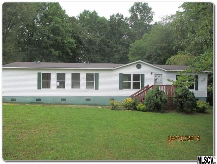 Charming Country Doublewide on 1.75 in Crabtree Acres in Vale! Home is in a Cul-De-Sac which is private and tree-lined. Large deck for entertaining or enjoy the huge open grassy backyard. Interior has great open floor-plan which tons of natural light from the many windows. Living/Dining Combo room opens to Huge Kitchen with center island. Grand Master Suite with great master bath and garden tub.