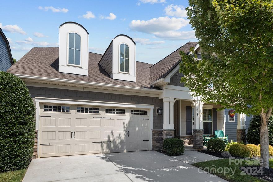 You'll fall in love with this immaculate bright and airy CalAtlantic home located in Fort Mill. Features include a charming covered front porch to greet you and an open floor plan with wide-plank flooring throughout most of the house. The main-level office has French doors & a trey ceiling. And, the Kitchen won't disappoint! It's decked out with stainless steel appliances, large seating/work island; 5-burner 36" gas cooktop, built-in convection oven & microwave, granite counters and a walk-in pantry. The Living Room has a gas fireplace, inset lighting & ceiling fan. The Main-level Primary Suite has a coffered ceiling, an upgraded fan & a spacious walk-in closet. The Primary Bath has tile floors, a double vanity, tiled-shower & deep garden tub. Wrought-iron stair rails lead you to the second level, here you'll find a loft, 2 bedrooms, full bath w a double-vanity & walk-in attic storage. Extras include the screened-in back porch, fenced yard, paver patio, and irrigation.