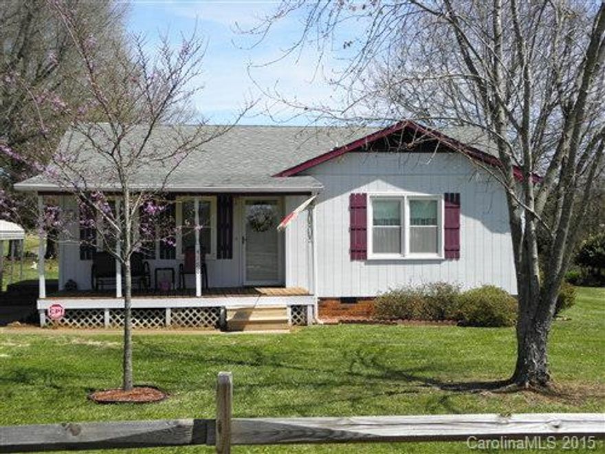 ADORABLE BUNGALOW WITH COMPLETELY UPDATED INTERIOR. lovingly updated; neutral colors, kitchen cabinets, counter tops, floor coverings, windows, doors and bathroom. Large living area with pass through eat-in kitchen gives the appearance of a larger space. Convenient laundry closet for full size appliances and separate linen closet. Wonderful .46 acre corner lot with out-building for lawn care storage. From the front to the back this home has delightful country views.