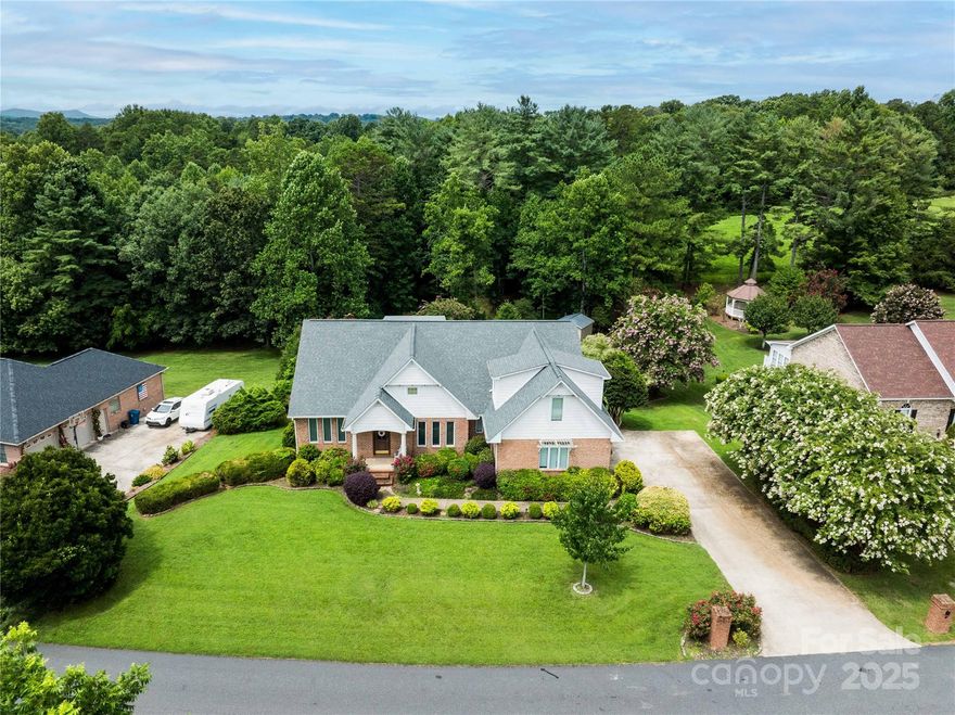 Discover the charm of 38 Par Drive in Granite Falls, NC, a 3-bedroom, 5-bathroom single-family home nestled in the desirable community of The Greens. Built in 2000, this spacious residence offers approximately 3,757 square feet of thoughtfully designed living space on a 0.57-acre lot, complete with top-rated schools and low taxes.

**Interior Highlights:**
- Soaring 23-foot vaulted ceiling in the Great Room.
- Warm ambiance with two gas fireplaces.
- Custom closets for ample storage.
- A RainSoft whole-house filtration system ensures pristine water quality.
- Luxurious Jack & Jill bath featuring an ADA-compliant soaking tub.
- Gourmet kitchen equipped with stainless steel appliances, double ovens, a gas range, and sleek granite countertops.

**Extra Spaces:**
- A Finished Room Over Garage (F.R.O.G.) with closet and full bath, perfect for guests.
- Versatile basement with a full bath, kitchenette, pool table, and custom built-ins, ideal for entertaining or creating separate living spaces.
- Additional unfinished basement area suitable for a workshop or storage.

**Exterior Features:**
- Enjoy leisure time in the heated saltwater pool with a Polaris cleaning system.
- Relax on the covered, screened veranda, perfect for outdoor entertaining or quiet mornings.

Located conveniently near Lake Hickory, Granada Farms Golf Course, shopping, and dining, this home is a blend of luxury and convenience. Currently listed for $665,000.