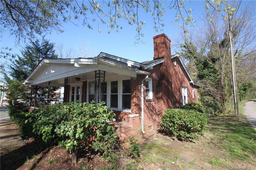 This 1930's bungalow overlooks the city skyline and is ready for renovation.  Property has had updates including replacement windows, plumbing, electrical, HVAC, and hot water heater but needs work.  Original hardwoods, moldings, and fireplace still exist.  Bring your design skills and make this an awesome property!  Sold AS-IS.