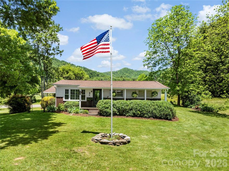 Nestled on 10 beautiful acres in a charming college town, this well-maintained ranch-style home offers the perfect balance of peaceful country living and convenient access—just 20 minutes to Asheville and 10 minutes to Marshall, and only 3 miles from I-26. 

The property is ideal for horses, farming, or gardening, with a serene setting surrounded by the natural beauty of Western North Carolina. Enjoy close proximity to the Blue Ridge Parkway, Appalachian Trail, skiing, golf, and whitewater rafting—making this an exceptional opportunity for outdoor enthusiasts.

The home features numerous thoughtful upgrades, including a new roof (2020), a beautifully remodeled kitchen (2025) with quartz countertops and stainless-steel appliances (gas range, refrigerator, microwave), and an updated bathroom (2024). Additional improvements include an encapsulated crawl space with foundation inspection (2025), a whole-home Generac generator, and a well installed in 2021.

Inside, you’ll find heart of pine floors, slate tile, solid wood interior doors, and plantation shutters throughout, creating a warm and timeless feel. Outdoor living is a highlight, featuring a spacious deck perfect for entertaining, along with a gazebo, hot tub, firepit, and outdoor shower. A natural spring on the property provides an additional water source for the home alongside the well.

An outbuilding with electricity and a large front porch adds even more versatility and charm to this unique property. 

Whether you're seeking a private retreat, homestead, or full-time residence, this property offers space, comfort, and an exceptional mountain lifestyle.