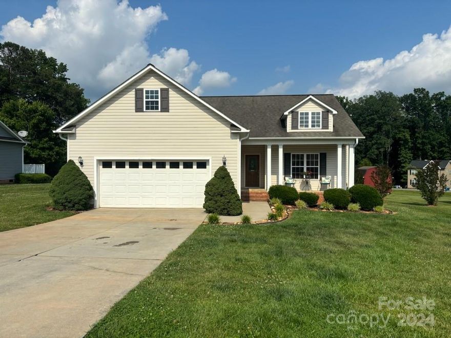 Charming home in a convenient location! Enjoy the cozy front porch and spacious back deck, perfect for relaxing or entertaining. The large kitchen features a bar for extra seating, ideal for gatherings. The living room boasts a warm atmosphere with gas logs, creating a welcoming space. Beautiful arched doorways add a touch of elegance throughout the home. This property combines comfort and style, making it the perfect place to call home. Don't miss out on this gem!