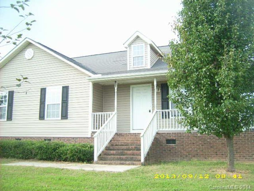 Rock on your front porch of this beautiful 3 bedroom 2 bath country home that is on a large 1 acre lot. There is no water supply (home will need new well,used to share and that is no longer option) and a new drain field for the septic sys. will have to be established on to the subjects property , currently encroaches on neighbor.