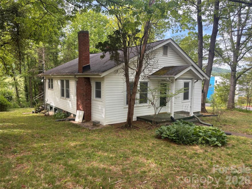 New investment opportunity in Asheville. This property sits on 1.05 acres on a quiet dead-end road and features two bedrooms and one full bath.

The home offers a simple layout including a living room, dining room, and a spacious kitchen. It also includes a newer garage, a carport, and ample yard space. Please note that the basement has an exterior entrance only.

This is an excellent opportunity for flippers or investors to bring their own ideas and realize the potential of this property.