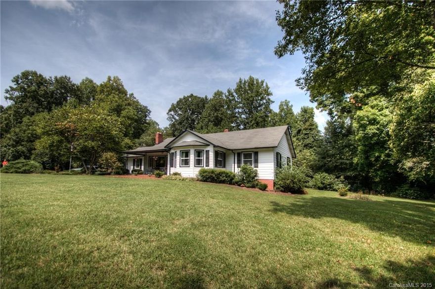 Convenient to Charlotte yet feels like you're in the country!Enjoy approx 3 acres!Lovely older home with beautiful hardwood floors, sits off the road with an expansive front yard!Large eat-in kitchen plus dining room!Huge family room AND living room with closet.Original pine panelling! Detached 2 car garage PLUS a second 2 car garage with wired shop!Rustic smokehouse & barn!Utility basement!Lovely plantings & trees!Enjoy the space and natural setting!Very convenient to shopping and I-485!