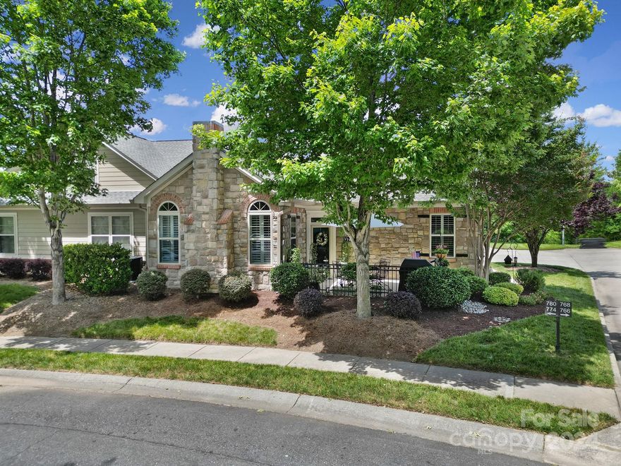 Prepare to fall in love with this tastefully updated condo in one of Tega Cay’s most sought after communities. Walk to restaurants, shopping & the proposed Main Street District. This highly desirable floorplan features large MASTER SUITES ON BOTH LEVELS providing versatility for multi-generational living, comfortable guest stays & a live-in care giver. The main level also includes a guest bedroom, kitchen, dining room, living room with fireplace & laundry room plumbed for utility sink. Significant upgrades throughout; luxury kitchen & bath renovations, plantation shutters, batten molding, fireplace surround, newer carpet, paint, appliances, LVP flooring & door hardware, truly too much to list! Abundance of storage areas inside home plus large garage. HOA includes water, sewer, landscaping, garbage collection, exterior/roof maintenance, access to common area & resort like amenities (outdoor pool, library, workout facility, clubhouse, park & sidewalks). Hurry, this beauty won't last.