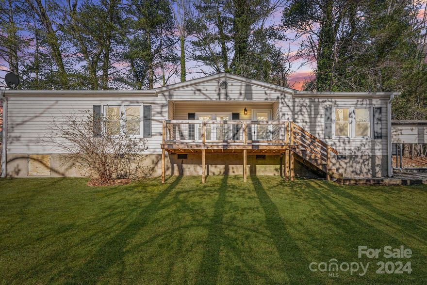 Situated approximately 15 minutes from both Brevard and downtown Hendersonville, and within 30 minutes of the Asheville airport, this home boasts an enviable location. Named one of the best places to retire, Hendersonville offers a welcoming atmosphere and easy access to amenities. For outdoor enthusiasts, this area is an absolute haven. And after a day of exploring, unwind with a visit to one of the local micro-breweries or vineyards. As you step inside, you'll be greeted by a spacious and inviting living space, perfect for entertaining guests or simply relaxing with loved ones. The open carport provides convenient parking, while the large walk-in closets offer ample storage space. With three bedrooms and two bathrooms, this home provides plenty of room for the whole family.
Outside, you'll find an outbuilding for additional storage and nearly half an acre of unrestricted land to customize as you wish.Don't miss out on this amazing property. Freshly painted and move-in ready!