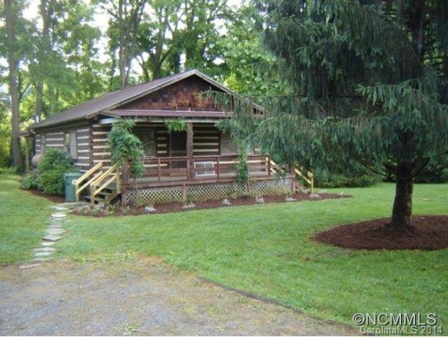 Just 25 Minutes North of Asheville and within walking distance to the pretty Town of Mars Hill or Mars Hill University a Classic log cabin sits with long front porch for rocking and a babbling stream in the back for philosophizing!  Ready to move in this great little house for young and old has sweeping open rooms, cathedral ceiling fire place and lots of love poured into it over the years you can see.