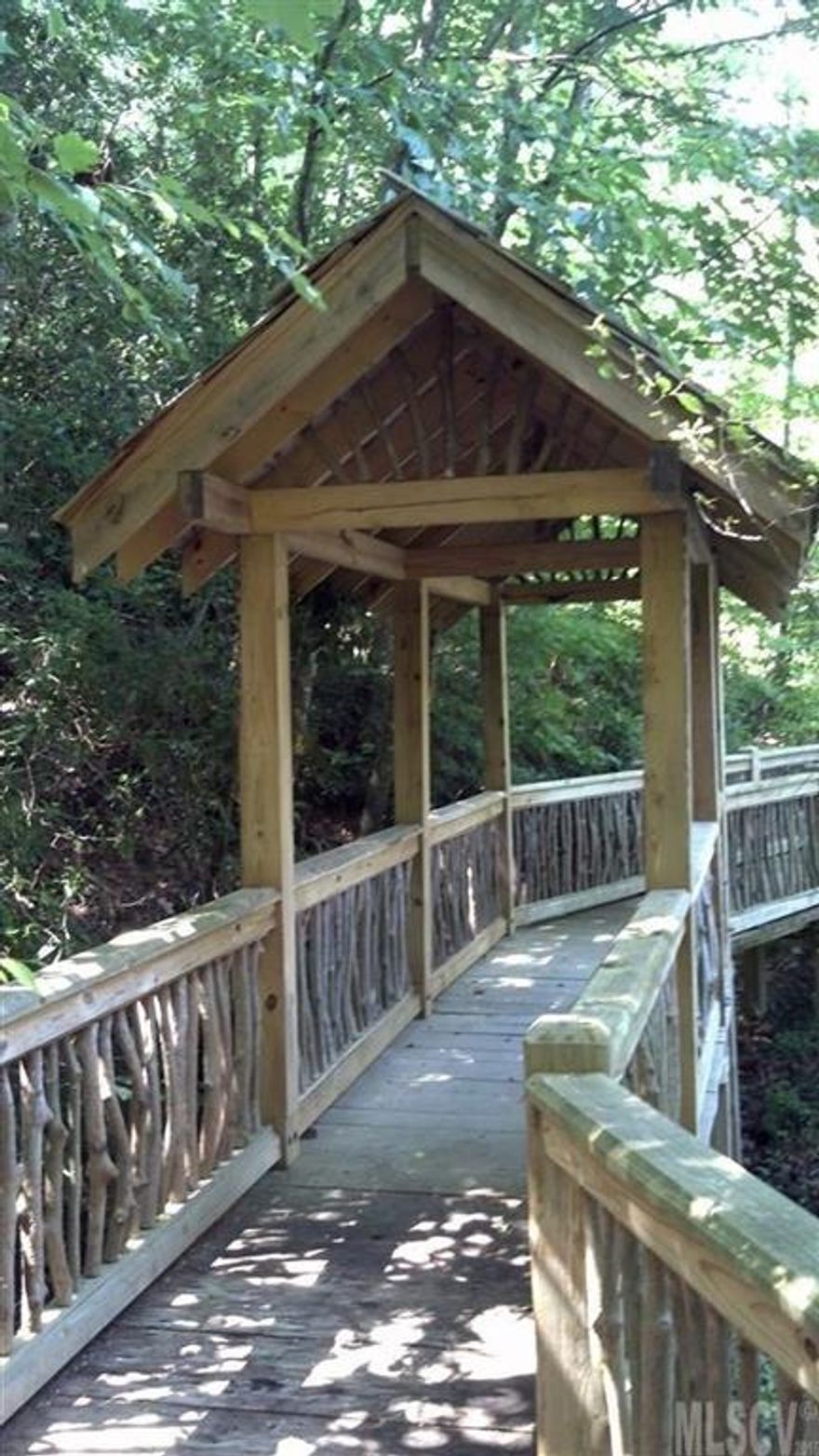 Private, Gated Community. Beautiful mountain views, rolling pasture and wooded lots provide the perfect backdrop for your dream home. Enjoy private landscaped trails, covered bridges, three stocked ponds and patio with fire pit for gathering.