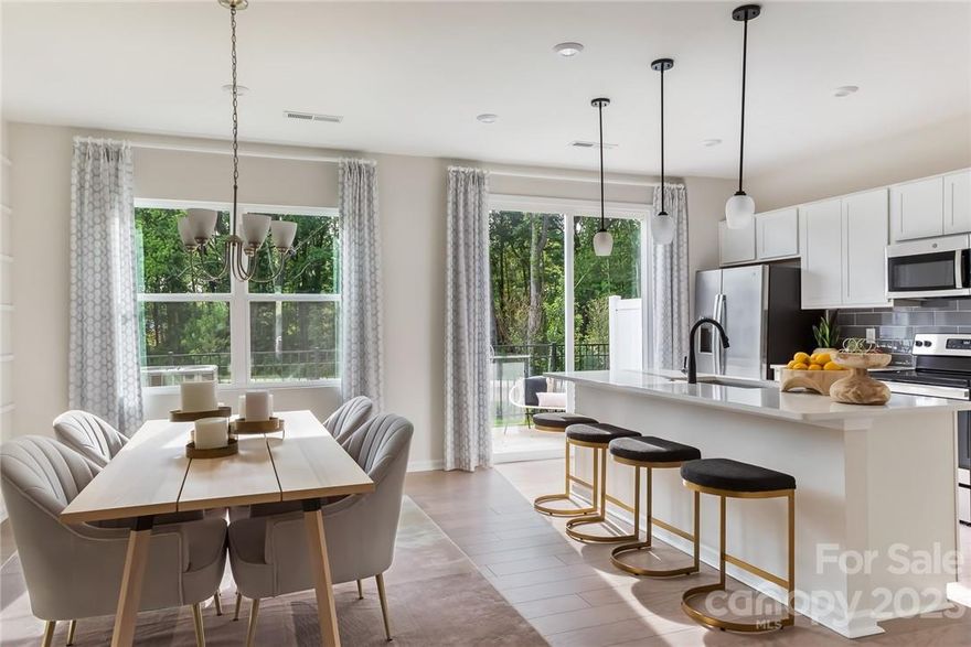 Beautiful Model Home End Unit for Sale with the Timeless I Design Package, an Upgraded Kitchen w/ 30" Electric Range, 6' Sliding Glass Door in Kitchen connecting to the Extended 10' x 10' Patio, Oak Box Staircase, Added Dog Area Under Staircase, Added 3rd Bedroom ILO Loft, Upgraded Primary Shower w/ Tile Walls, Upgraded Secondary Bathroom w/Tub Surround, and Added End Unit Windows at a Competitive Price. Appliances (Refrigerator, Washer, and Dryer) are included with purchase.

The kitchen has been upgraded with the Timeless I Design Package, presenting a high-end 30" electric range, elevated stainless steel appliances, burlap cabinets, light gray backsplash tile, all tied together by the stylish Caledonia granite counter tops. Just off the kitchen through a 6' sliding glass door is the extended 10' by 10' outdoor living space.

Upstairs, there are three bedrooms and two full bathrooms, including the primary suite, featuring an upgraded shower w/ tile walls.