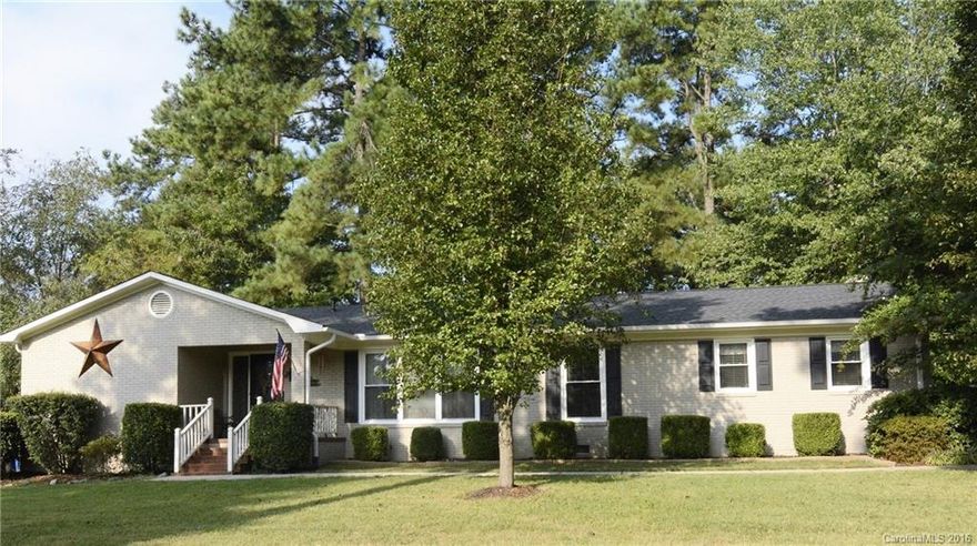 Charming updated all brick ranch. Welcoming foyer. Remodeled gourmet kitchen designed for a chef offers lots of counter space, granite, tile back splash, island, 42" custom soft closing cherry cabinets & open to dining area. Family room w/stone fireplace. Master bedroom includes master bath w/ walk in shower. Large utility room that can easily be converted to garage. Private fenced in back yard w/covered patio great for entertaining. Come see this home & see that it's meant to be your home.